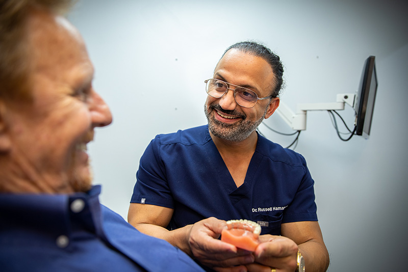 Close up of young woman's face with crooked teeth. Teeth before install braces. Teeth need ortodonti doctor (dentist) help.