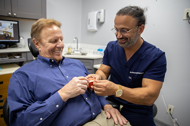 Close up of young woman's face with crooked teeth. Teeth before install braces. Teeth need ortodonti doctor (dentist) help.